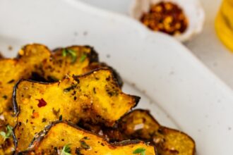 Roasted acorn squash served on a white plater.