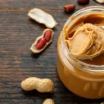 Jar of peanut butter on table