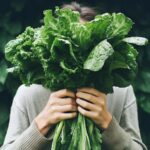 woman holding spinach